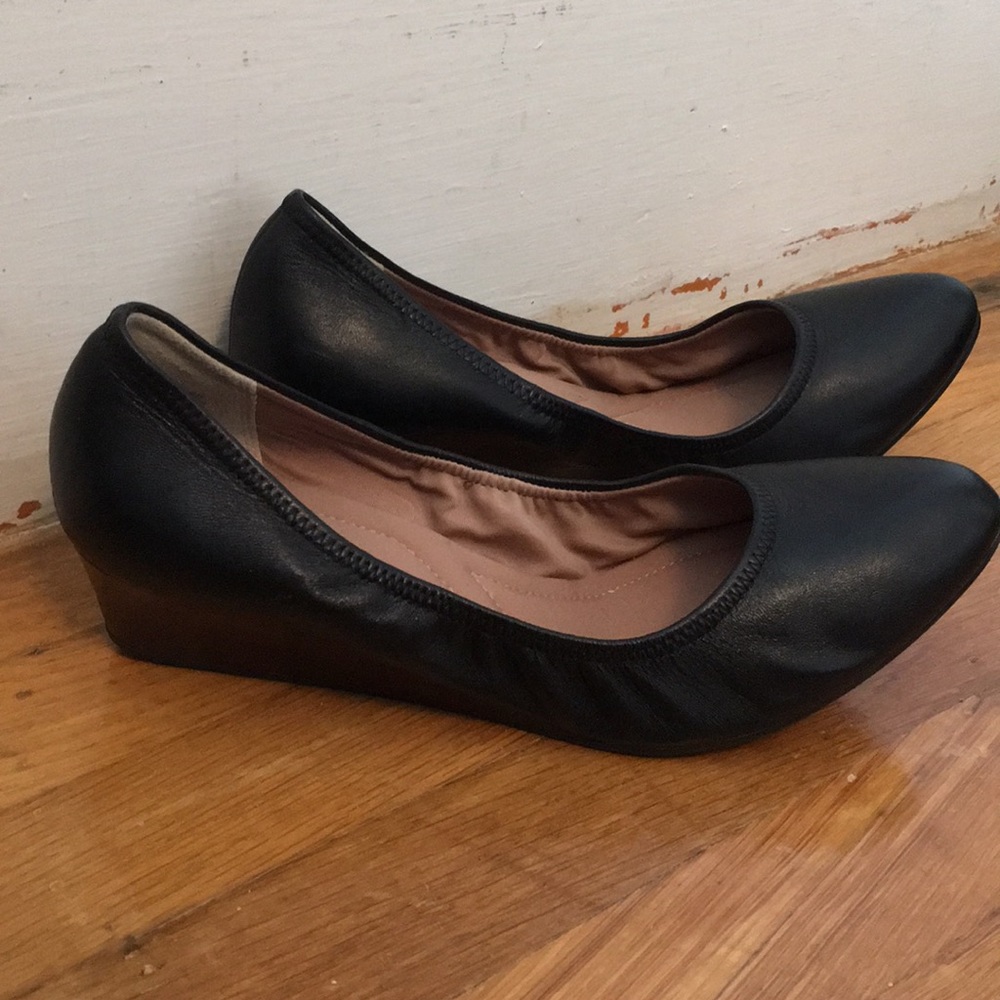 Black leather pumps